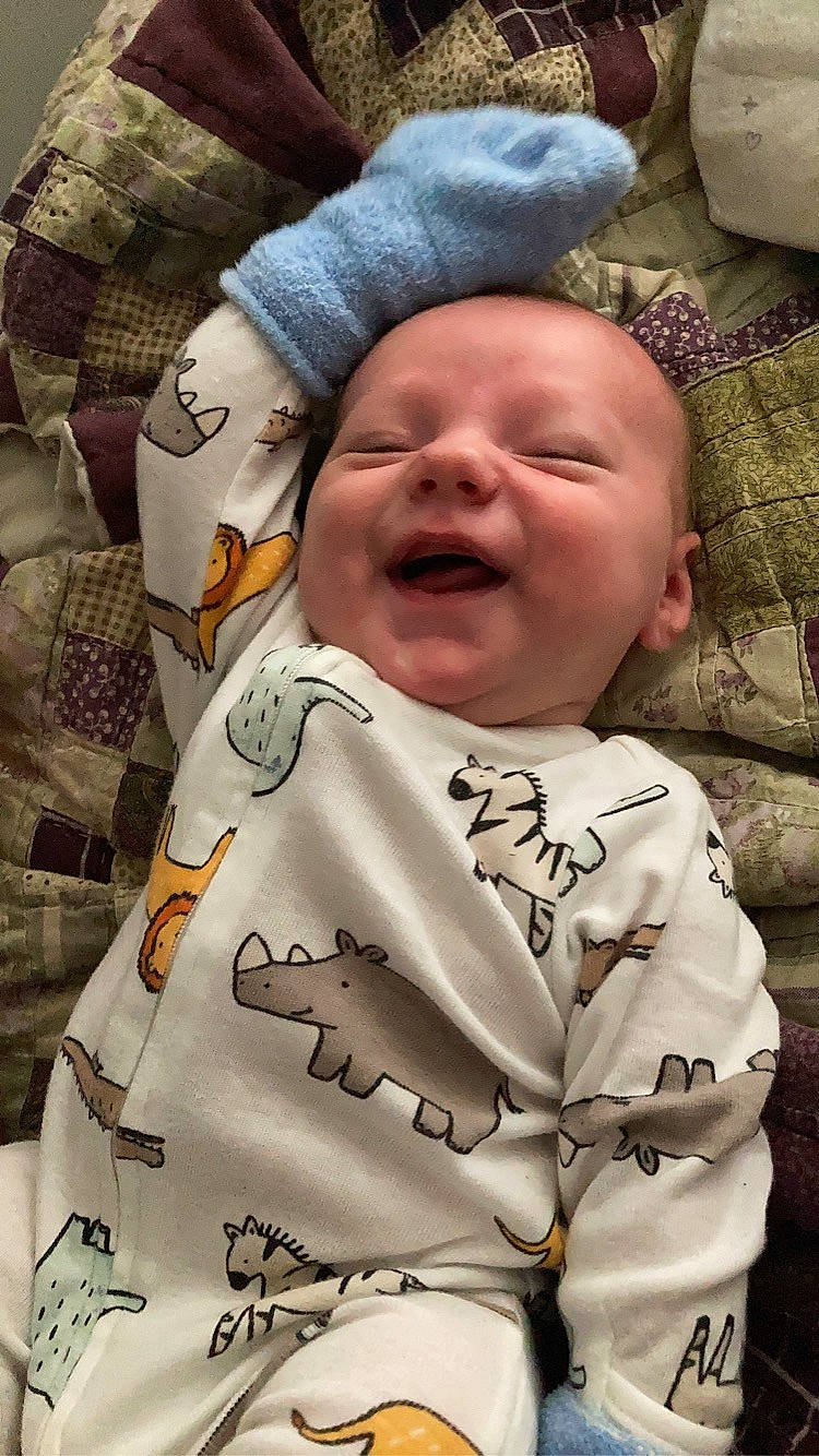 Kylar is registered to the contest to win money with this photo: baby, baby_laughing, baby_toddler_clothing, cheek, child, comfort, event, face, gesture, happy, hat, head, linens, pattern, person, product, sleeve, smile, toddler, uniform