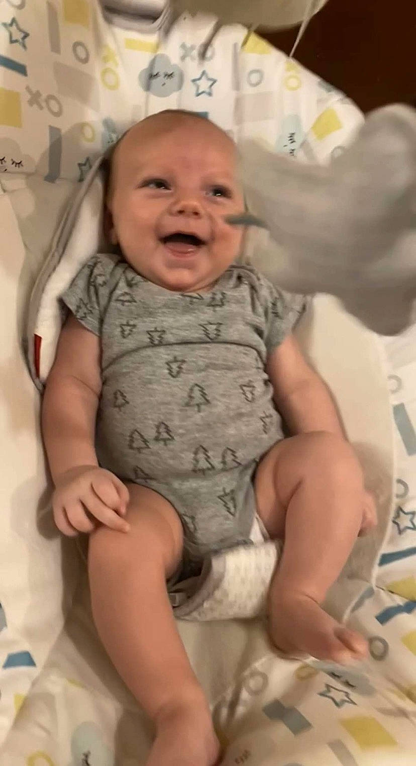 Kylar is registered to the contest to win money with this photo: arm, baby, baby_toddler_clothing, cheek, comfort, eye, face, facial_expression, gesture, hairstyle, hand, happy, head, human, mouth, nose, person, skin, sleeve, smile