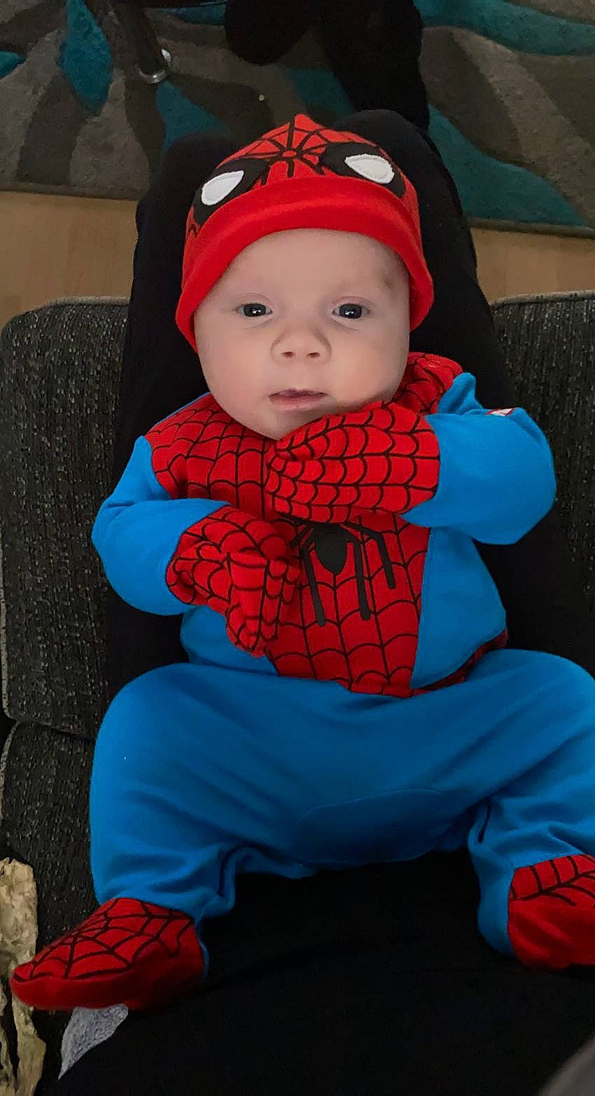 Hunter is registered to the contest to win money with this photo: azure, baby, baby_carriage, baby_toddler_clothing, cap, cheek, child, comfort, cool, electric_blue, eye, face, fun, headgear, headwear, human_body, outerwear, person, personal_protective_equipment, red