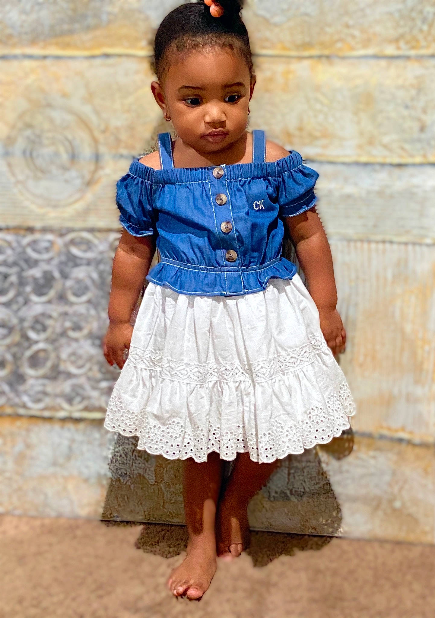 Jacee joined the competition — help win amazing prizes! baby, baby_toddler_clothing, blue, cheek, child, child_model, clothing, denim, dress, pattern, people, person, photography, skin, standing, textile, toddler, tradition, white, yellow
