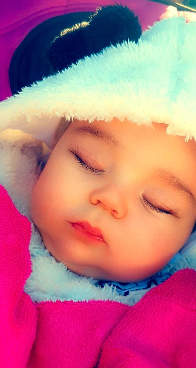 Elyana participe au concours pour gagner de l'argent avec cette photo : baby, baby_toddler_clothing, cap, cheek, chin, eye, eyebrow, eyelash, face, fur_clothing, happy, headgear, headwear, iris, lip, nose, outerwear, person, pink, skin