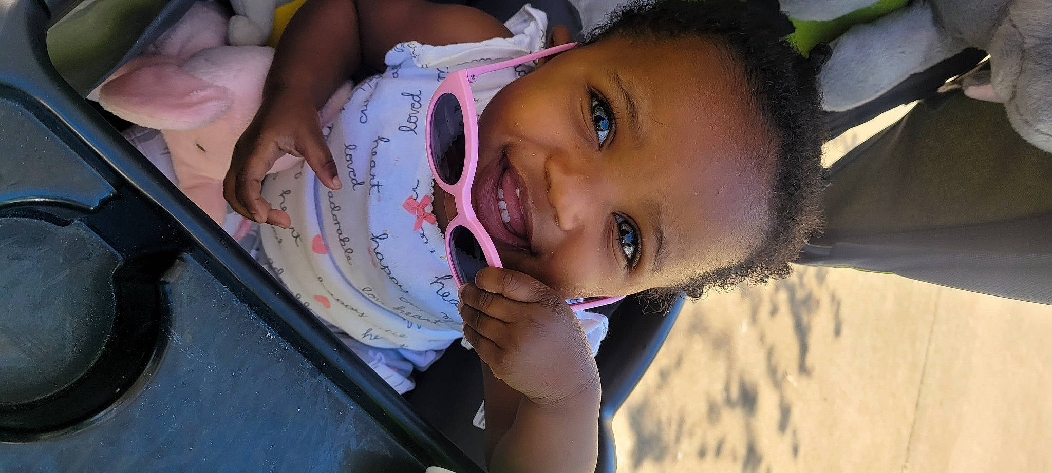 Lillian is registered to the contest to win money with this photo: baby, cheek, child, eyelash, finger, fun, hand, happy, iris, laugh, leisure, lip, mouth, nail, nose, person, sitting, skin, smile, toddler