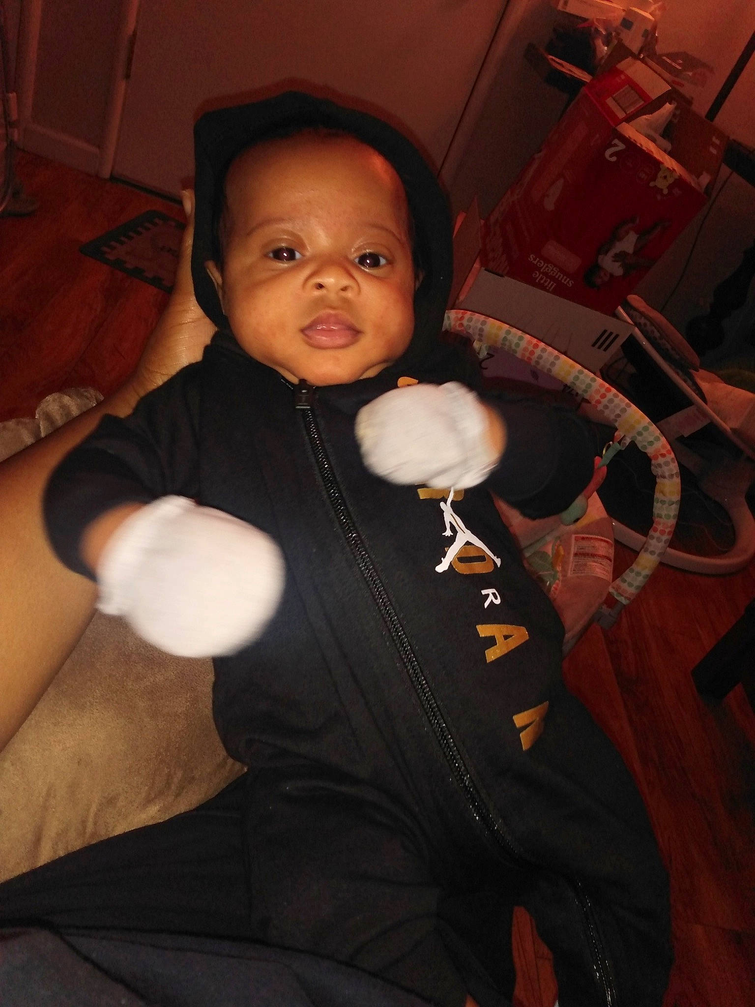 Messiah is registered to the contest to win money with this photo: abdomen, baby, baby_toddler_clothing, cheek, child, comfort, eye, flash_photography, formal_wear, fun, fur, gesture, head, person, room, sitting, skin, thumb, toddler, trunk