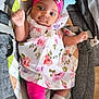 baby, infant, child, pink_headband, floral_dress, leggings, white_socks, baby_carrier, plush_moon, plush_star, toy, face, cute, smiling, indoors, wooden_floor, fabric, bow, person, portrait
