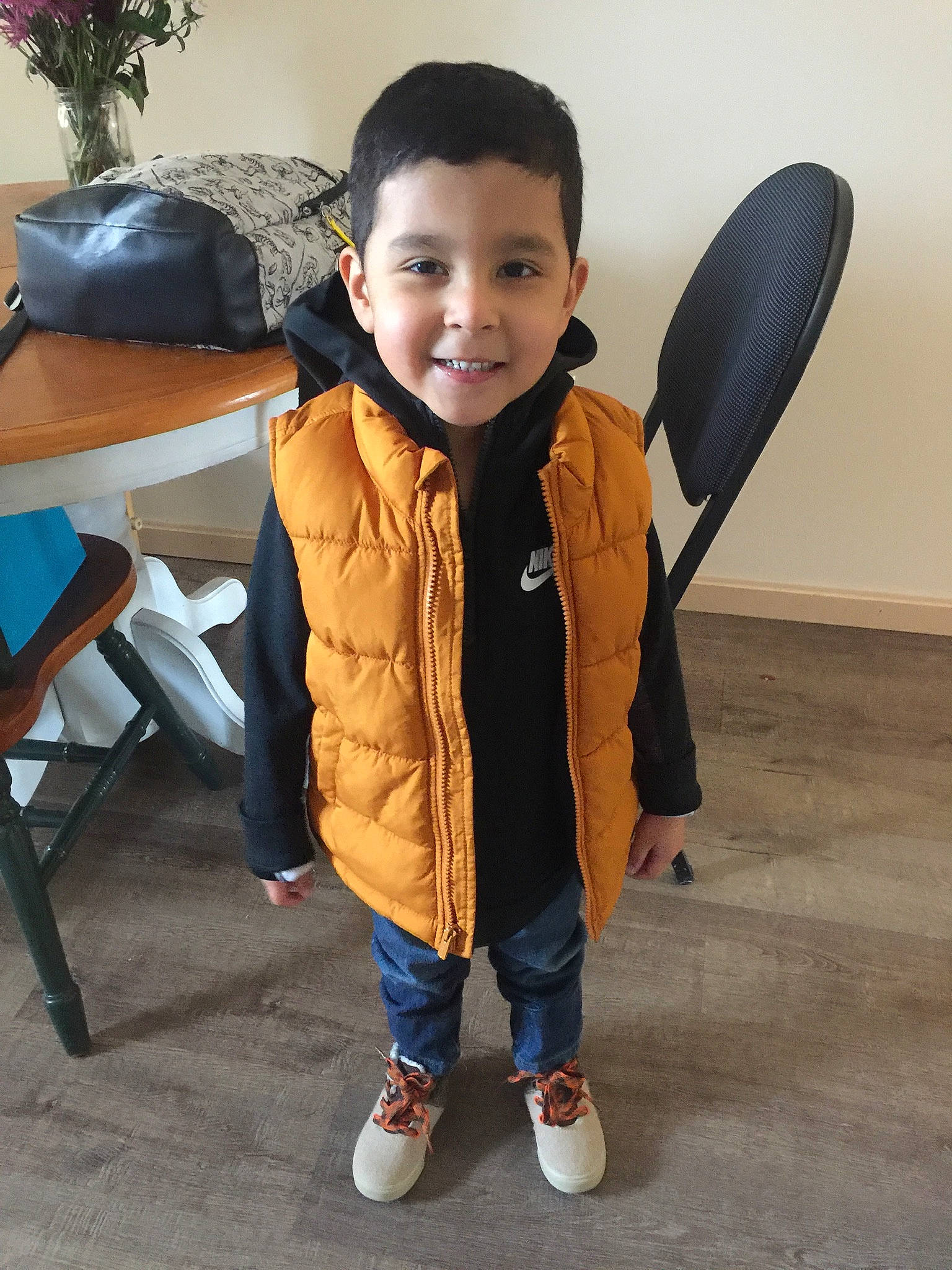 Arian joined the competition — help win amazing prizes! chair, eye, face, floor, flooring, fun, furniture, head, houseplant, jacket, joy, leisure, outerwear, person, shoe, sleeve, smile, sneakers, standing, t_shirt