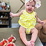Ariadna Ceslete is registered to the contest to win money with this photo: baby, smiling, yellow_outfit, bow, table, desserts, candles, strawberries, celebration, happy, child, face, legs, hands, food, sweet, indoor, person, cute, infant
