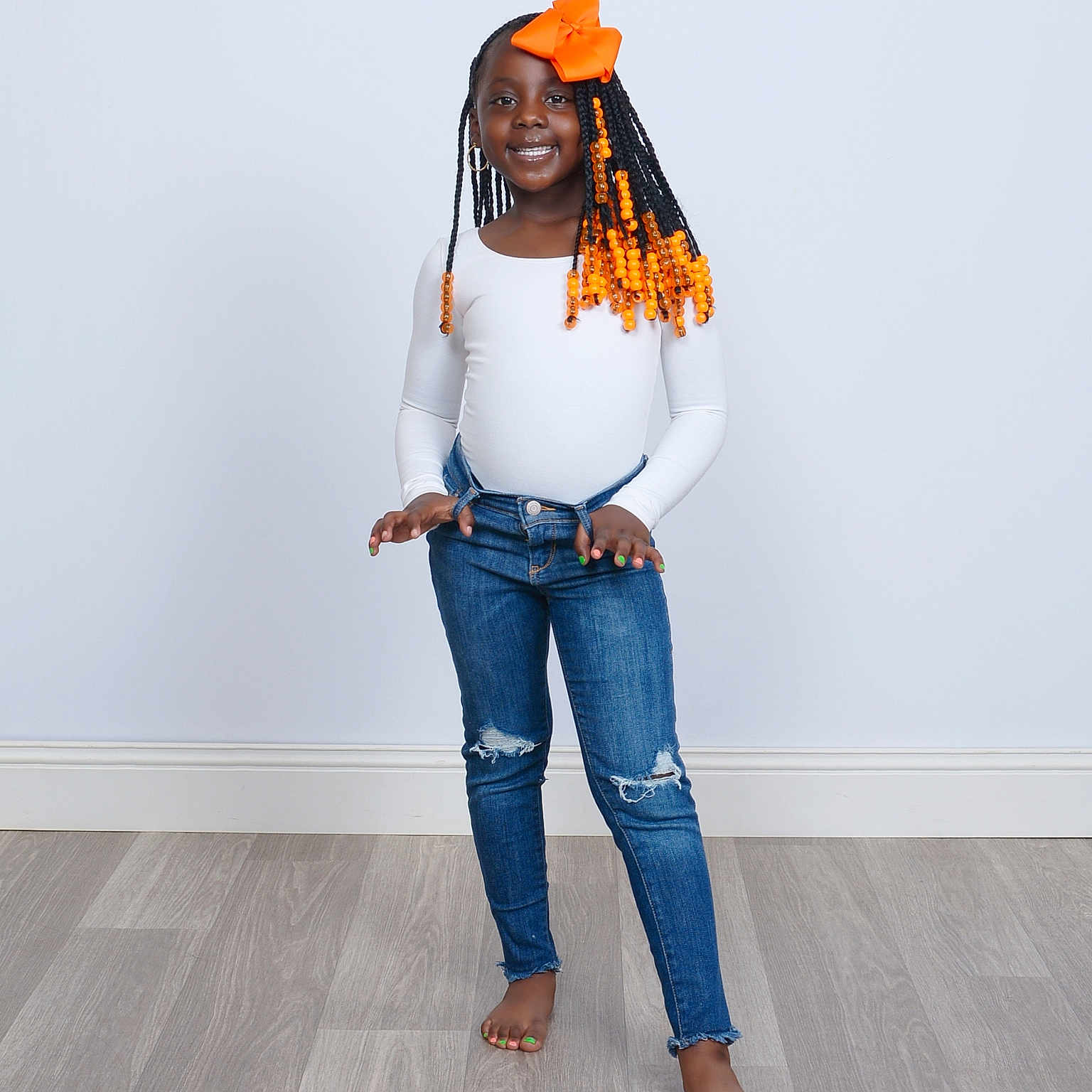 Ailynd is registered to the contest to win money with this photo: adult, blouse, clothing, face, female, footwear, hair, happy, head, jeans, longsleeve, pants, person, sandal, sitting, smile, standing, student, vest, woman