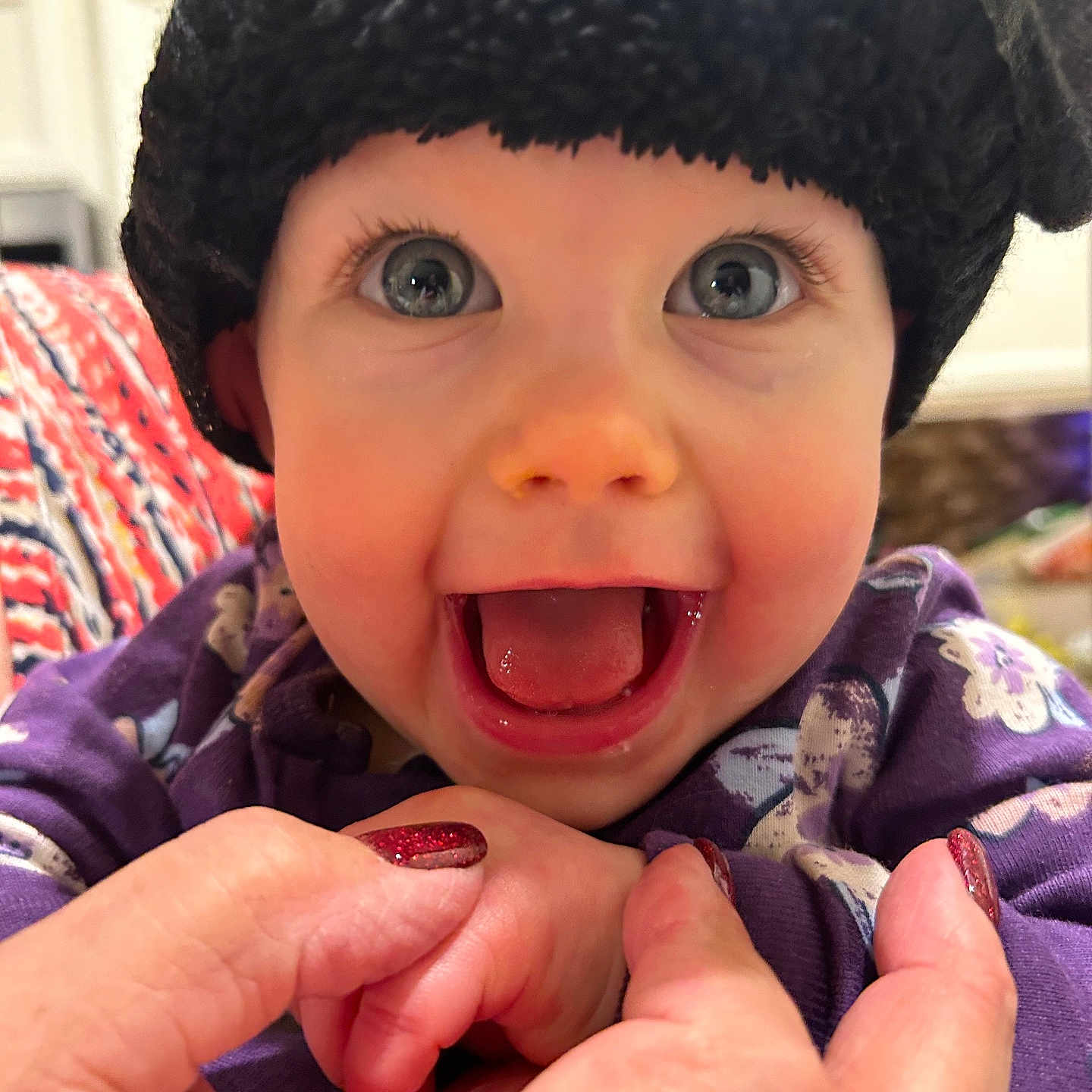 Lila is registered to the contest to win money with this photo: baby, babylaughing, beanie, bodypart, bonnet, cap, clothing, coat, face, finger, hand, happy, hat, head, jacket, mouth, person, photography, portrait, teeth
