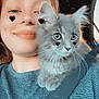 person, cat, kitten, selfie, car, seatbelt, striped_shirt, freckles, heart_sticker, closeup, cute, pet, companion, indoors, sunlight, animal, feline, whiskers, smile, young