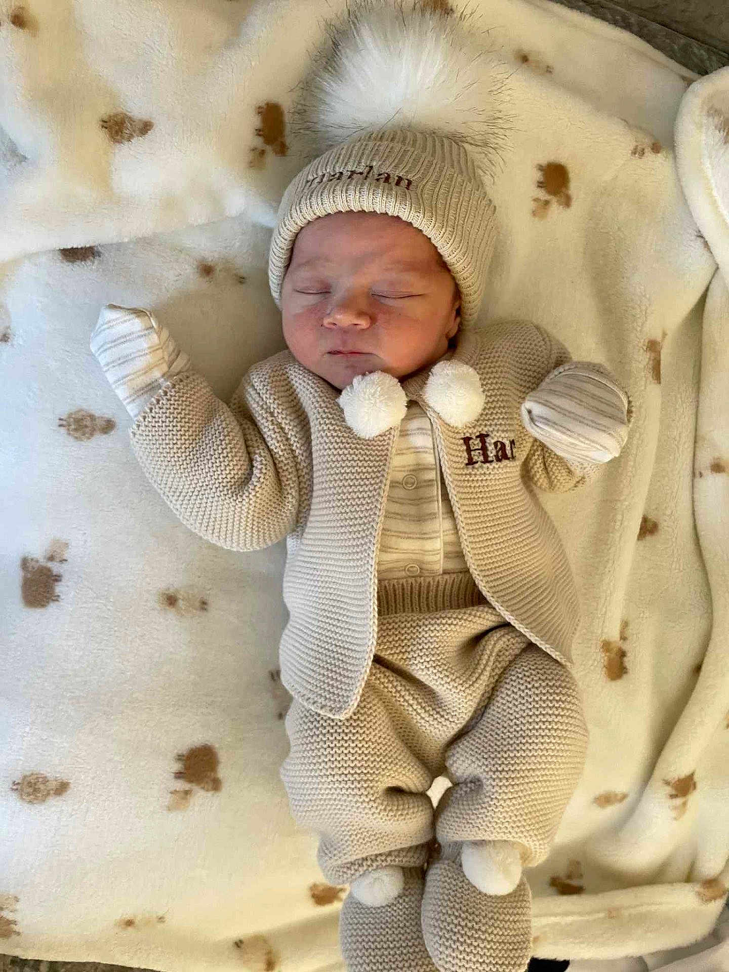 Harlan-Warren joined the competition — help win amazing prizes! baby, newborn, sleeping, blanket, knitwear, hat, pom_pom, mittens, cozy, soft, clothing, infant, cute, resting, warm, pajamas, lying_down, child, indoors, peaceful