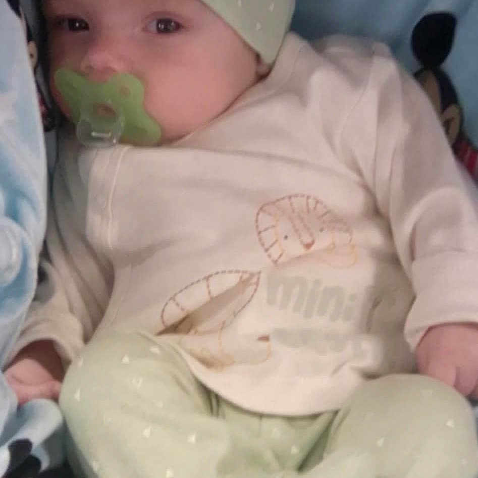 Wyatt Kash is registered to the contest to win money with this photo: baby, bed, blanket, bonnet, cap, clothing, cushion, face, furniture, glove, hat, head, homedecor, newborn, pants, person, photography, portrait, sleeping, tape