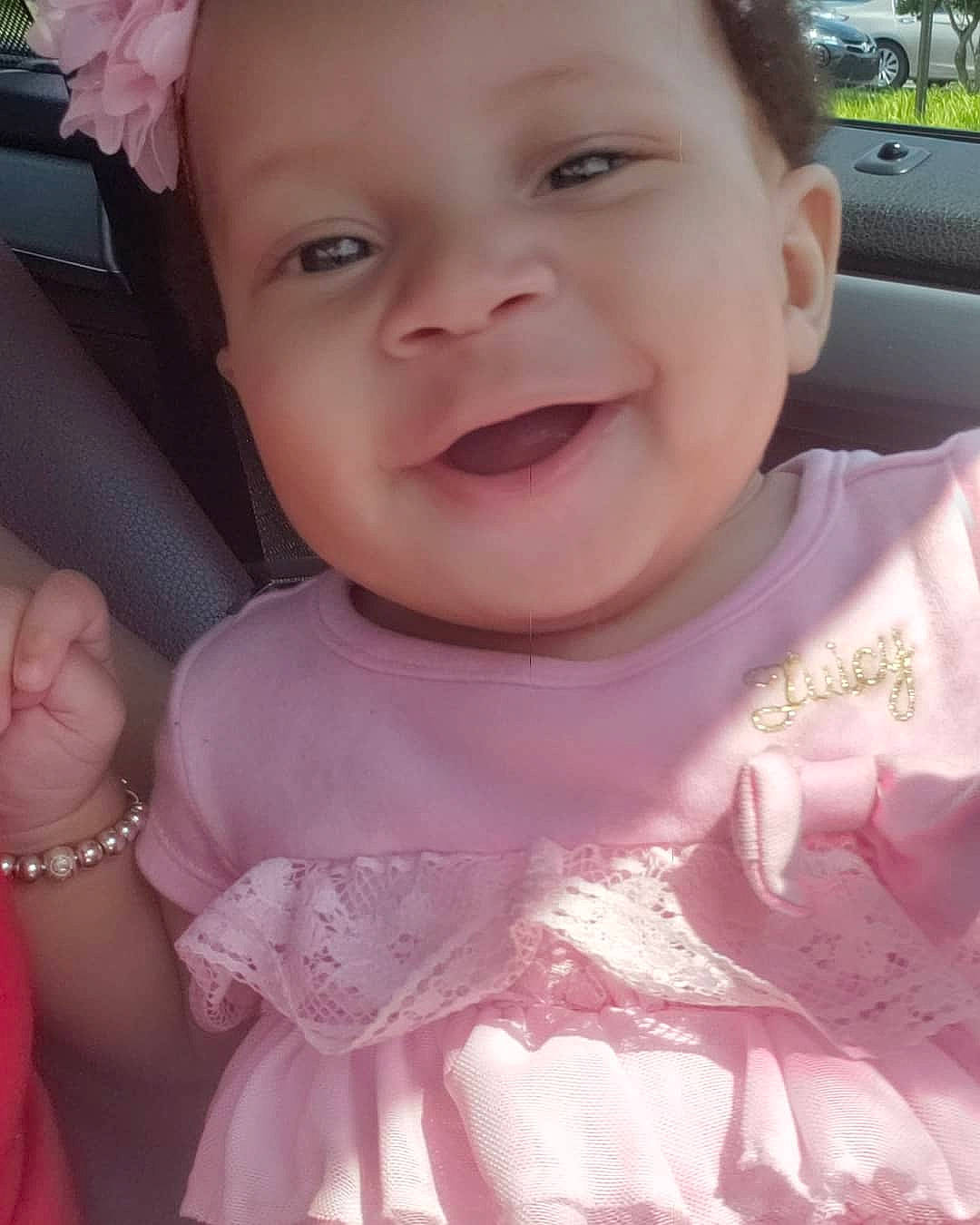 Carolyn is registered to the contest to win money with this photo: baby, cheek, child, chin, eye, face, facial_expression, forehead, fun, happy, head, laugh, lip, mouth, nose, person, pink, skin, smile, toddler