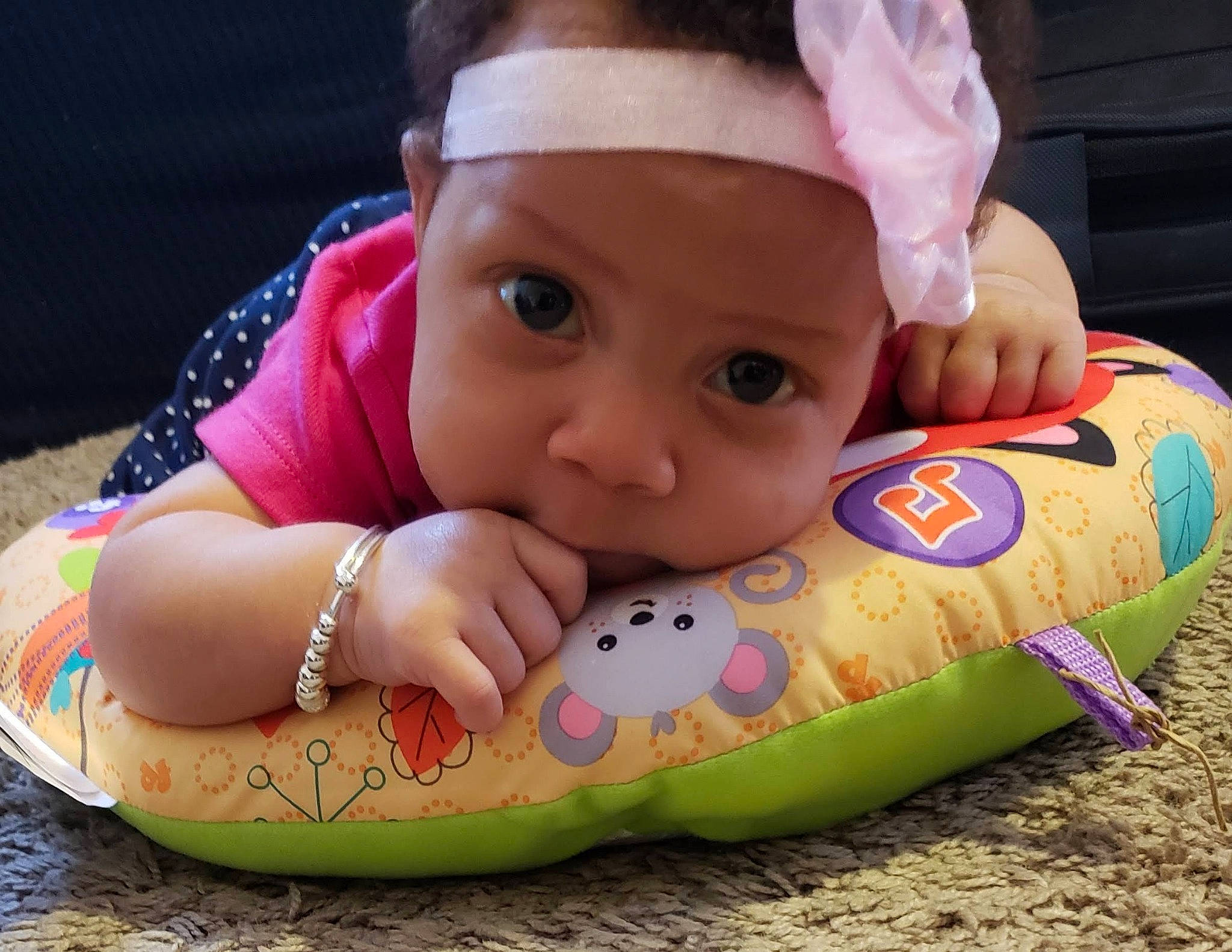 Carolyn is registered to the contest to win money with this photo: baby, baby_products, baby_toddler_clothing, baby_toys, cheek, child, face, fun, head, joy, lip, mouth, person, play, product, textile, toddler, toy, tummy_time