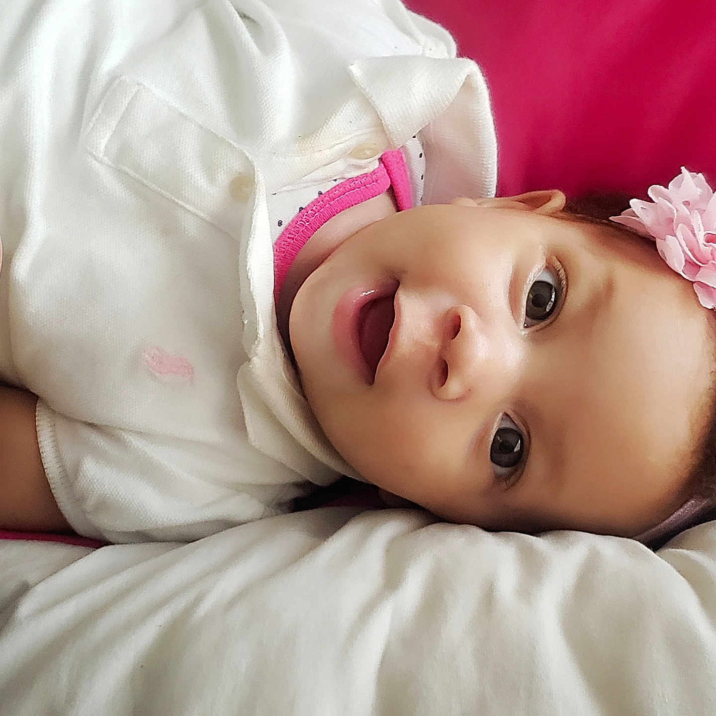 Carolyn is registered to the contest to win money with this photo: baby, beauty, cheek, child, close_up, eye, face, hair_accessory, hand, head, headgear, iris, lip, mouth, nose, photography, pink, product, skin, toddler