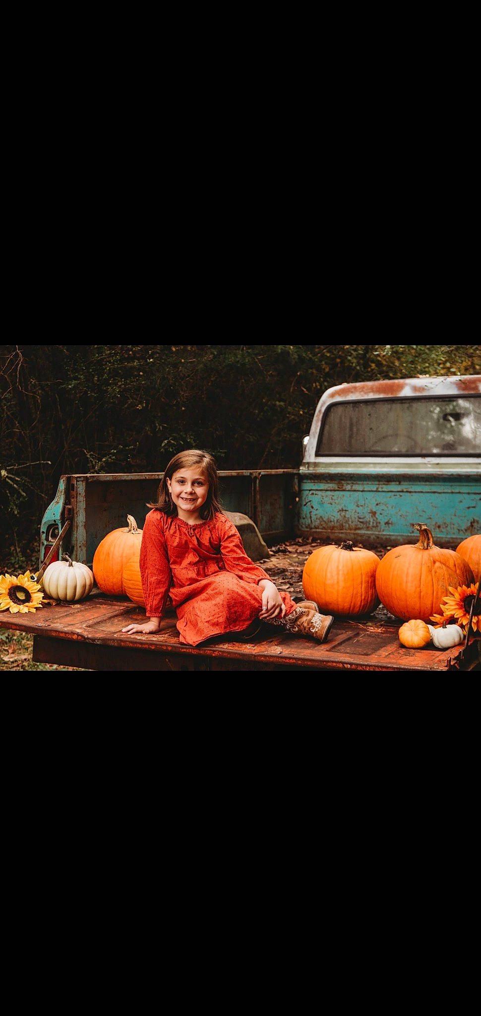 Ainslie joined the competition — help win amazing prizes! calabaza, cucurbita, event, fruit, gourd, joy, local_food, natural_foods, orange, performing_arts, person, plant, pumpkin, sitting, squash, still_life, still_life_photography, tints_and_shades, vegetable, window