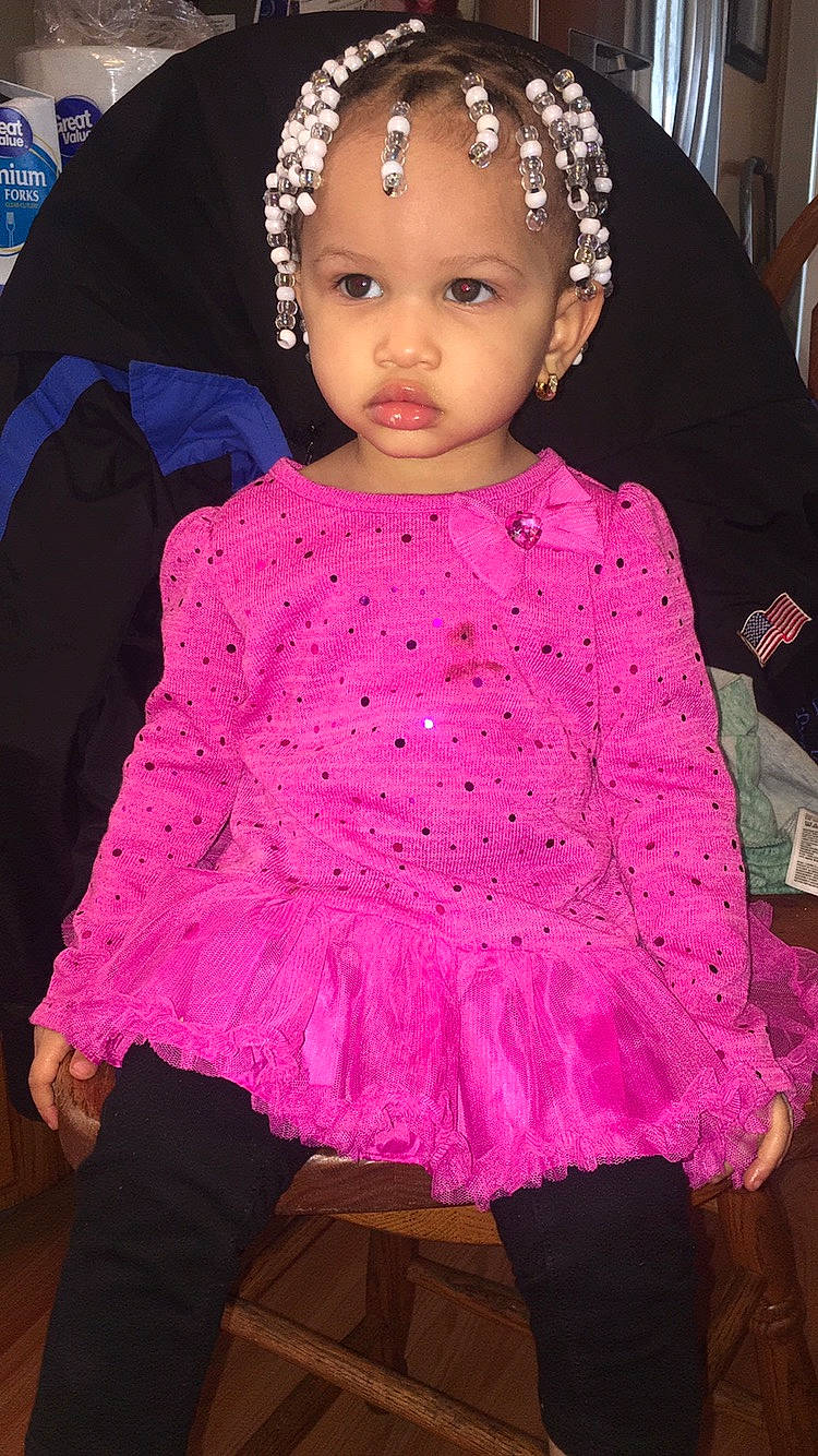 Cherish is registered to the contest to win money with this photo: baby_toddler_clothing, cheek, child, child_model, clothing, costume, dress, fashion_accessory, hair_accessory, magenta, outerwear, person, pink, purple, ruffle, sleeve, textile, toddler