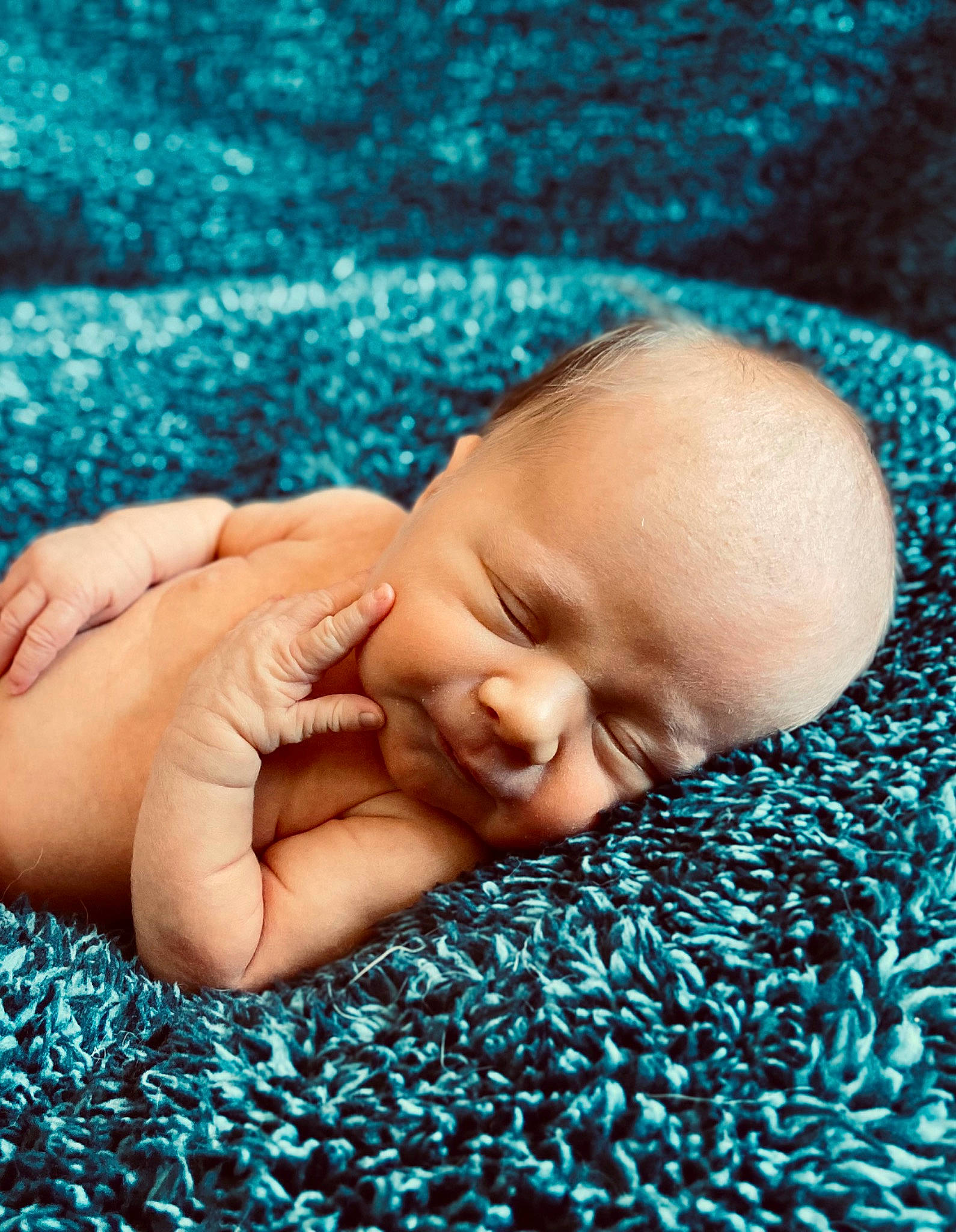 Andi is registered to the contest to win money with this photo: aqua, azure, baby, baby_toddler_clothing, blue, cheek, child, comfort, electric_blue, gesture, grass, green, happy, linens, nose, pattern, people_in_nature, person, skin, textile