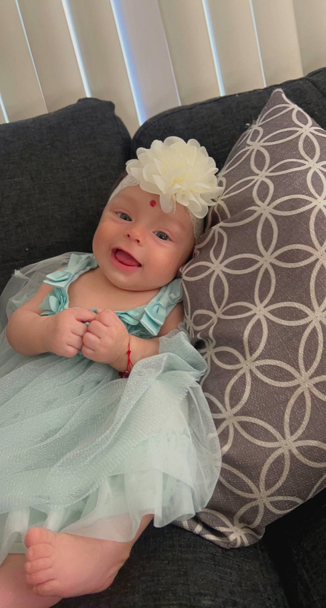 Alayna joined the competition — help win amazing prizes! baby, baby_toddler_clothing, cheek, child, comfort, couch, fashion_accessory, hair_accessory, happy, headband, headpiece, headwear, pattern, person, petal, pink, room, sitting, skin, smile