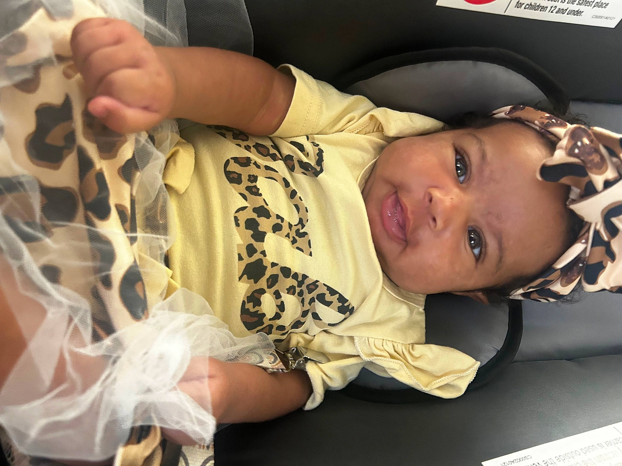Kori is registered to the contest to win money with this photo: arm, audio_equipment, baby, baby_products, baby_toddler_clothing, cheek, child, comfort, ear, eyelash, finger, happy, human_body, nail, nose, person, room, skin, sleeve, smile