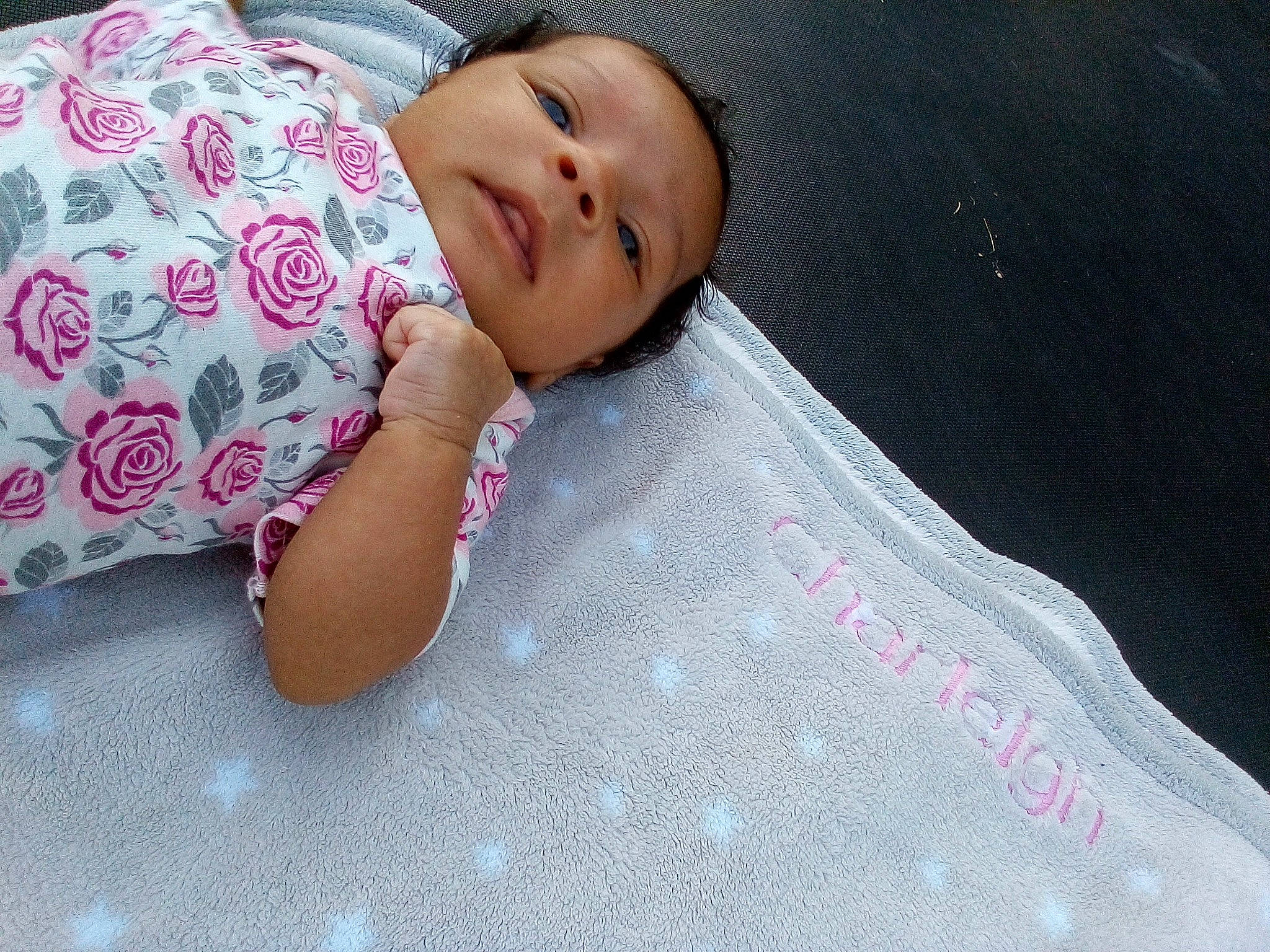 Charleigh is registered to the contest to win money with this photo: baby, baby_toddler_clothing, bedding, carmine, cheek, child, comfort, face, finger, floor, flooring, headwear, linens, lip, pattern, person, pink, room, skin, sleeve