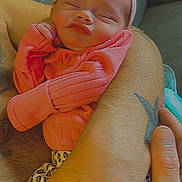 Josephine is registered to the contest to win money with this photo: baby, sleeping, pink_clothing, headband, tattoo, arm, hand, leopard_print, cozy, resting, cute, infant, person, skin, fingers, closeup, indoor, comfort, peaceful, newborn