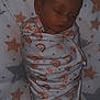 Josephine joined the competition — help win amazing prizes! baby, newborn, sleeping, swaddled, blanket, rainbow_pattern, stars, sheet, infant, cute, peaceful, resting, indoor, soft_lighting, child, face, head, warm, comfort, portrait