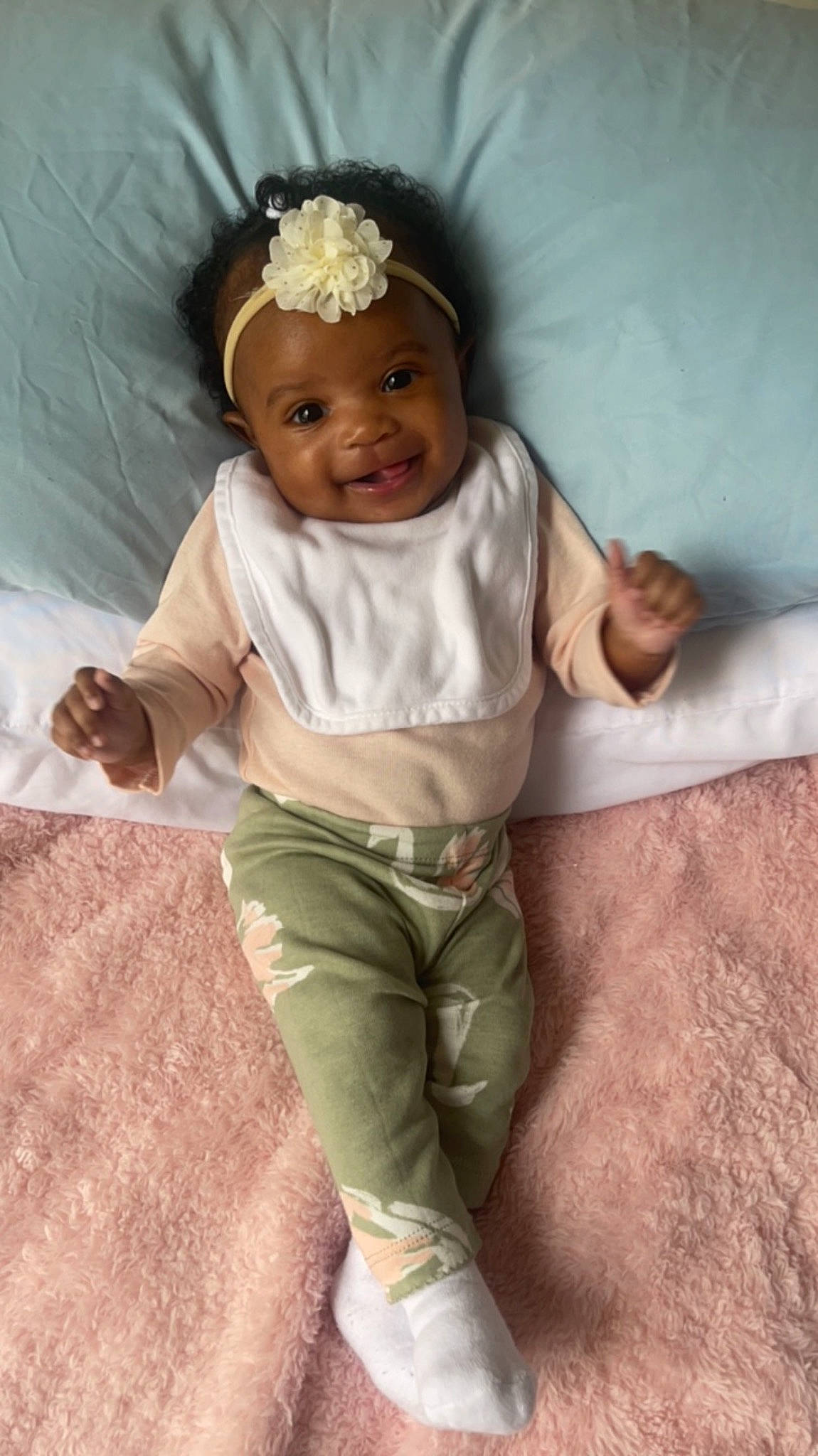Azariah joined the competition — help win amazing prizes! baby, baby_toddler_clothing, child, comfort, finger, gesture, hair_accessory, happy, headband, headpiece, headwear, human_leg, jewellery, khaki_pants, linens, person, sleeve, smile, t_shirt, thumb