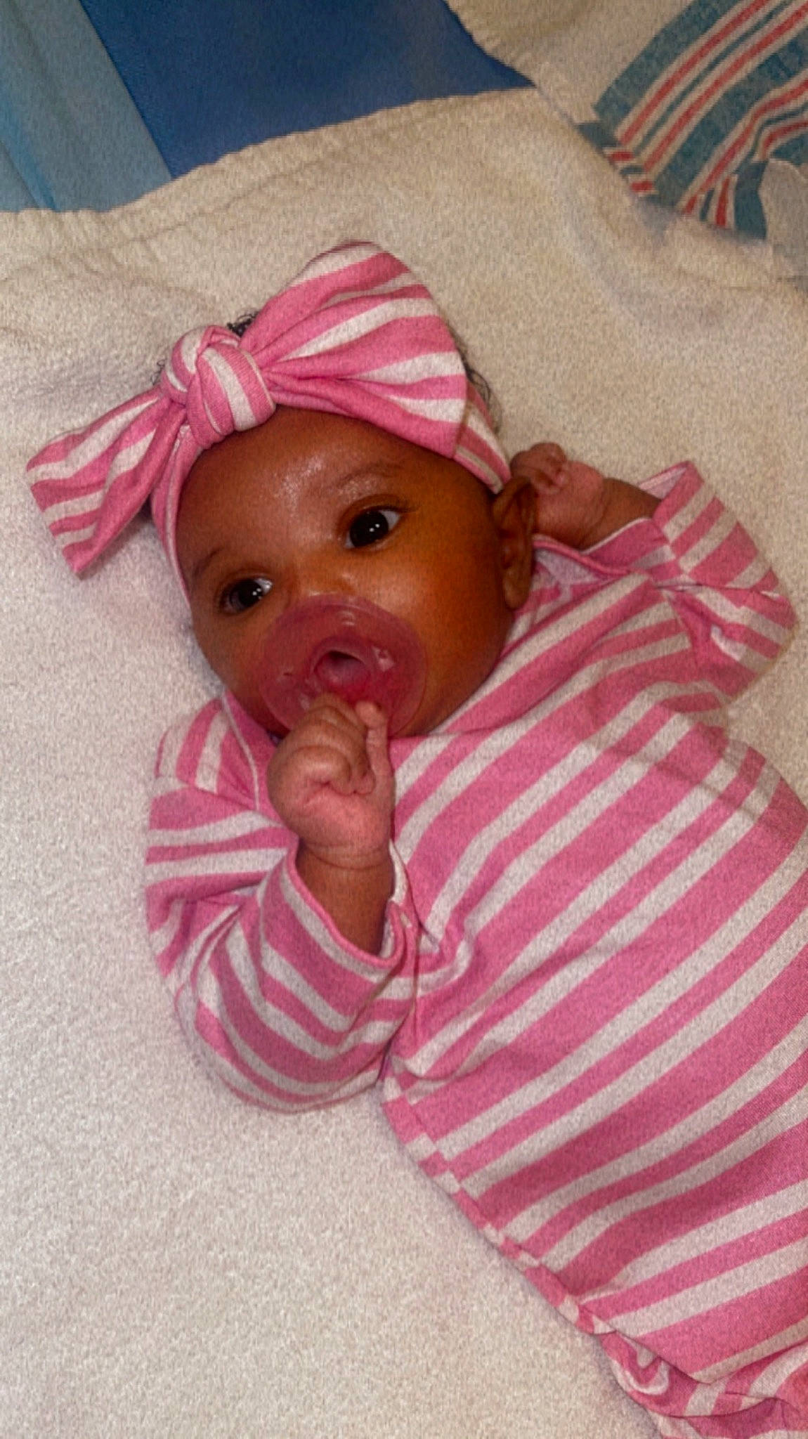 Azariah joined the competition — help win amazing prizes! baby, baby_products, baby_toddler_clothing, cheek, chin, comfort, eye, eyebrow, eyelash, face, facial_expression, happy, headwear, linens, lip, mouth, nose, person, pink, skin