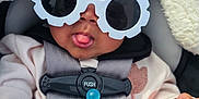Raelani is registered to the contest to win money with this photo: accessories, baby, blanket, bodypart, clothing, coat, cushion, face, finger, glasses, hand, hat, head, homedecor, jacket, newborn, person, photography, portrait, sunglasses