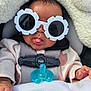 accessories, baby, blanket, bodypart, clothing, coat, cushion, face, finger, glasses, hand, hat, head, homedecor, jacket, newborn, person, photography, portrait, sunglasses