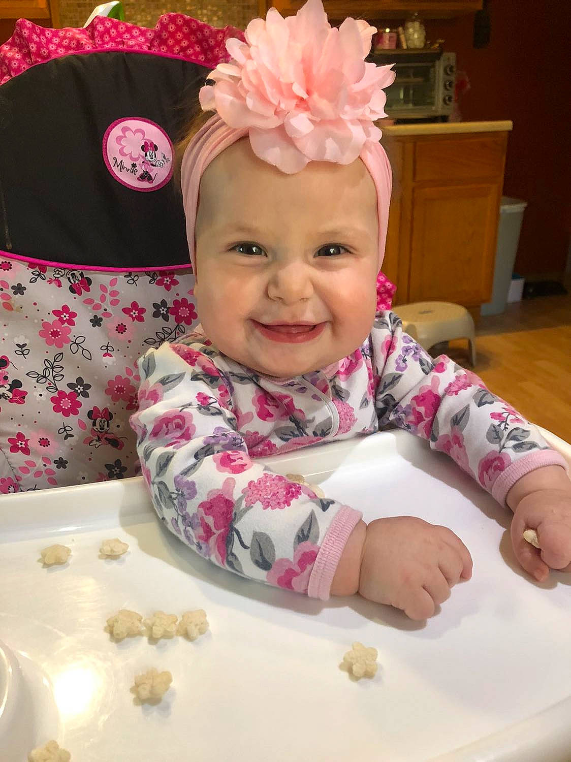 Addison is registered to the contest to win money with this photo: baby, baby_toddler_clothing, cabinetry, child, costume_hat, event, happy, hat, headband, headgear, headpiece, headwear, joy, magenta, person, pink, sleeve, smile, sweetness, textile