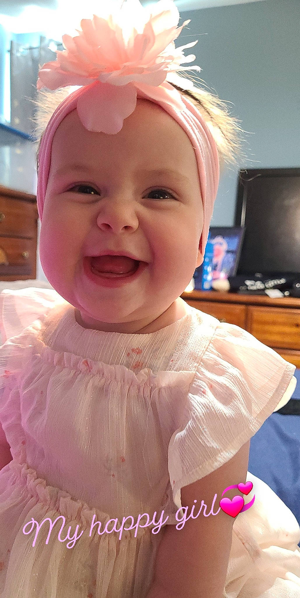 Addison is registered to the contest to win money with this photo: baby, baby_toddler_clothing, beauty, cheek, child, computer_keyboard, computer_monitor, dress, facial_expression, happy, headpiece, headwear, iris, joy, lip, magenta, peripheral, person, pink, skin