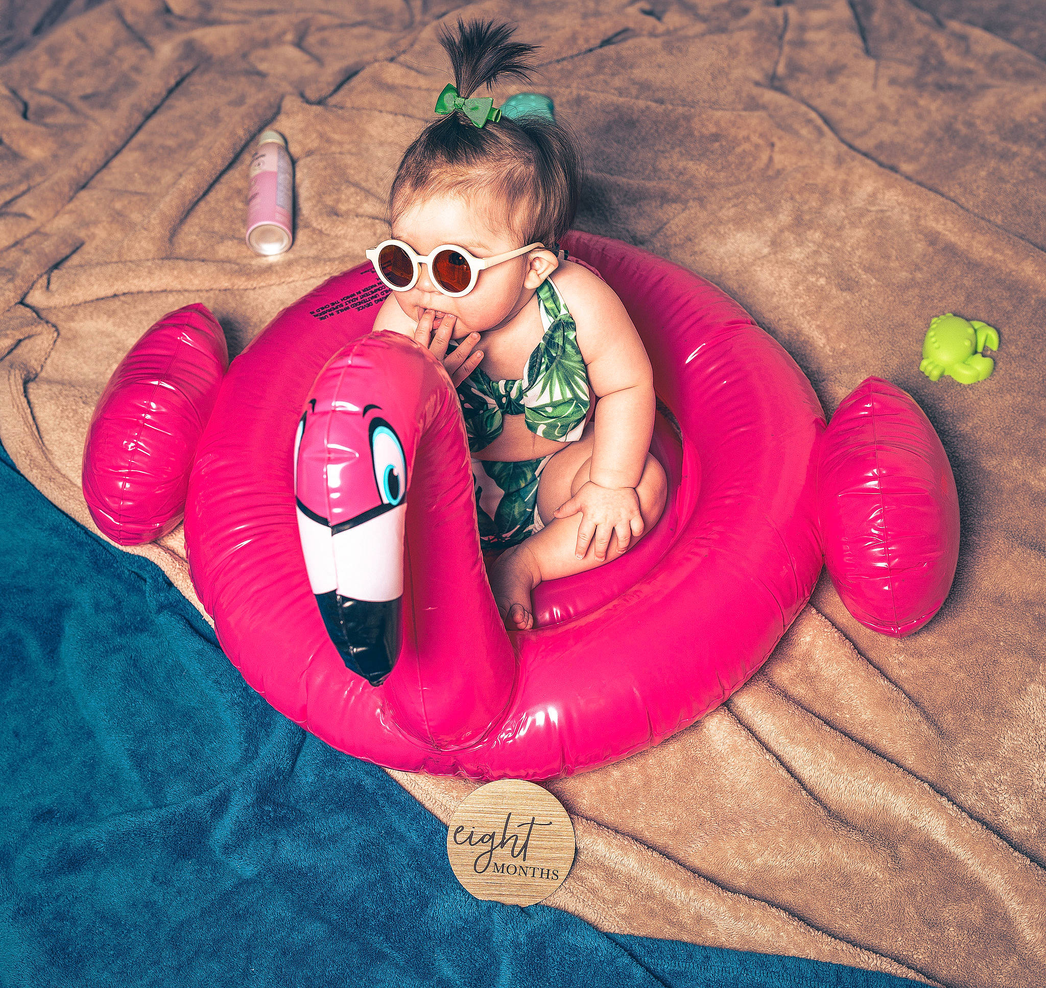 Valentina is registered to the contest to win money with this photo: baby_float, carmine, comfort, eyewear, fun, goggles, happy, human_leg, leisure, magenta, person, personal_protective_equipment, pink, product, recreation, sitting, smile, sunglasses, thigh, toddler