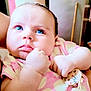 Lyana participe au concours pour gagner de l'argent avec cette photo : baby, blue_eyes, chubby_cheeks, close_up, curious, facial_expression, infant, indoors, light_skin, pacifier_clip, pink_clothing, plush, portrait, skin, soft_light, toddler, wearing, young_child, cute, hand