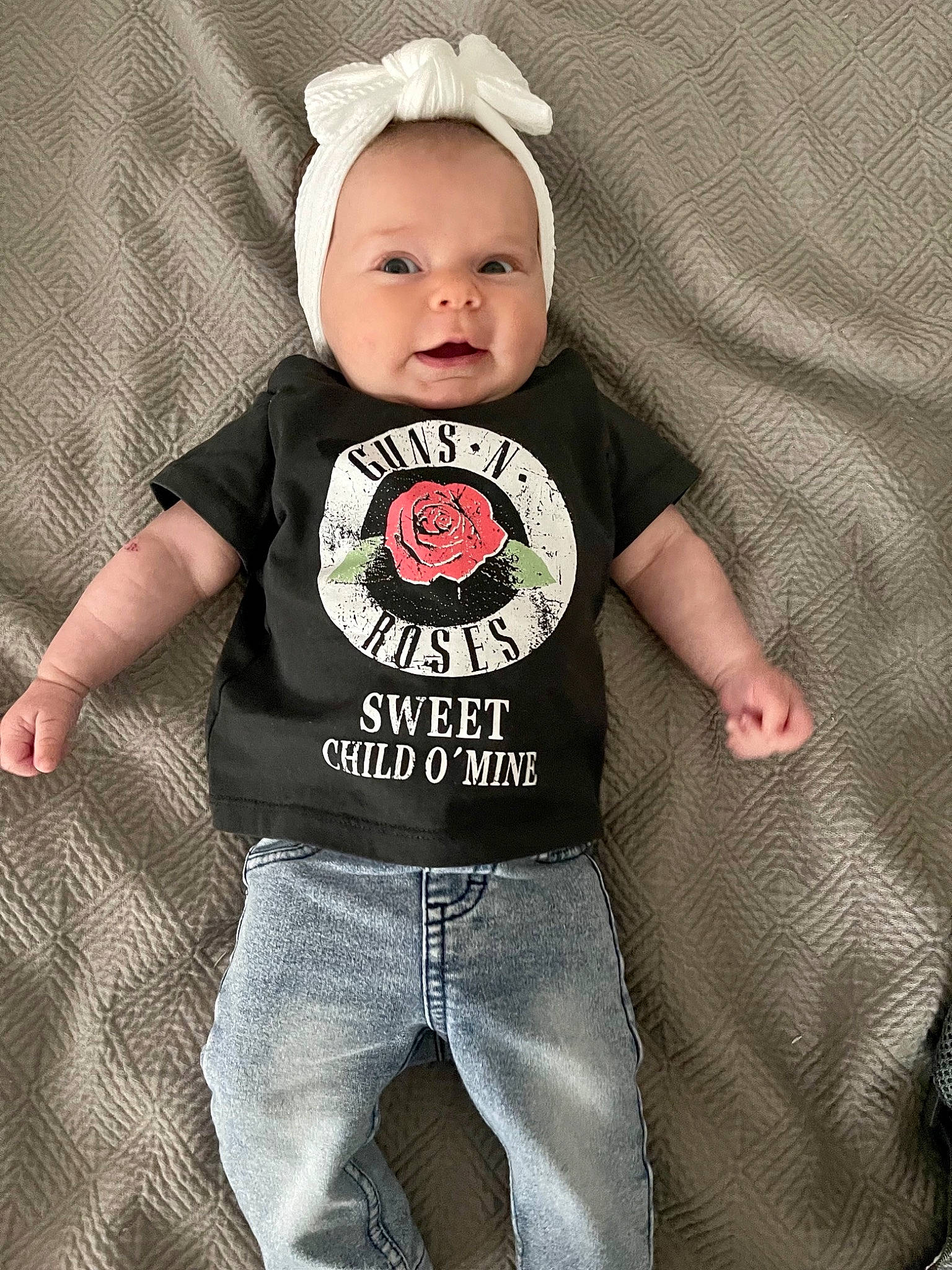 Dottie is registered to the contest to win money with this photo: baby, baby_products, baby_toddler_clothing, cap, child, cool, denim, fashion_accessory, flash_photography, font, grey, happy, neck, pattern, person, sleeve, sportswear, t_shirt, toddler, top