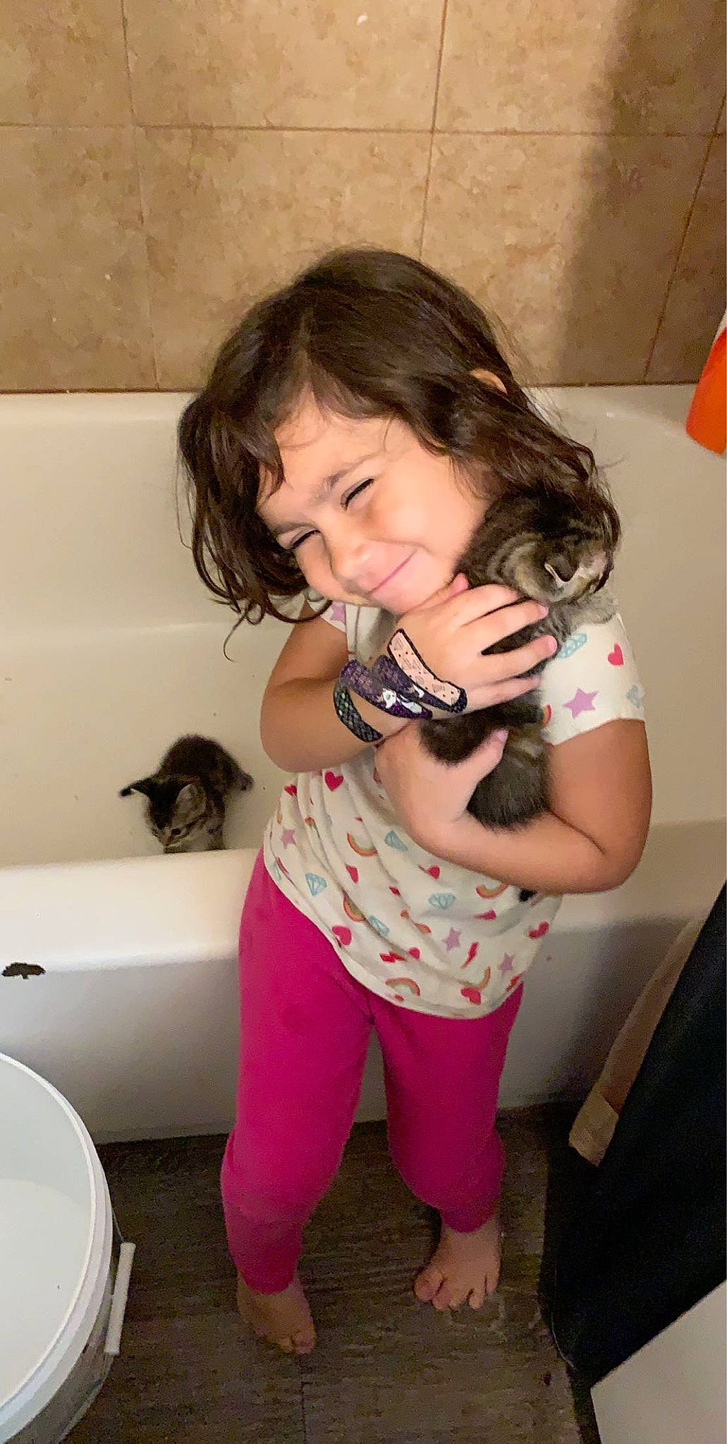 Selena is registered to the contest to win money with this photo: baby_toddler_clothing, bathroom, bathroom_accessory, bidet, cat, ceramic, felidae, household_supply, human, joy, person, pink, plumbing, plumbing_fixture, porcelain, small_to_medium_sized_cats, stomach, throat, tile, toilet