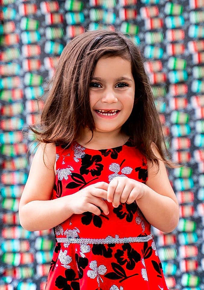 Selena is registered to the contest to win money with this photo: baby_toddler_clothing, beauty, brown_hair, child_model, day_dress, design, dress, iris, joy, long_hair, makeover, one_piece_garment, pattern, person, plaid, portrait_photography, red, ringlet, sleeveless_shirt, tartan