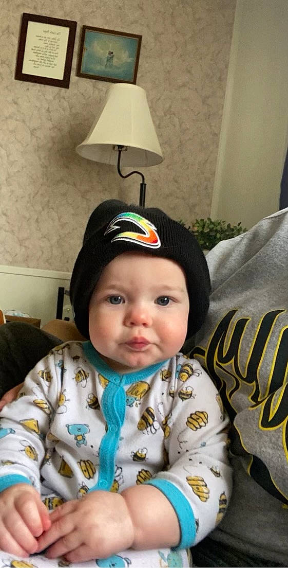 Mathew joined the competition — help win amazing prizes! baby, baby_toddler_clothing, bib, cap, chair, cheek, child, comfort, couch, eye, headwear, lamp, lampshade, light_fixture, nose, person, room, sitting, skin, sleeve