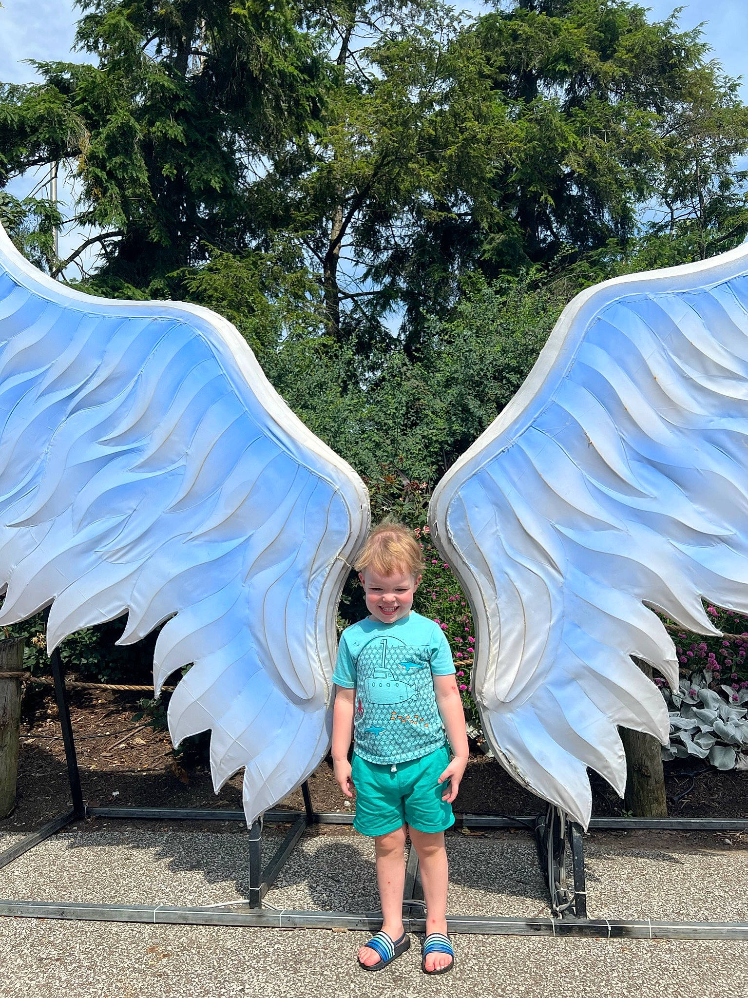 Mathew joined the competition — help win amazing prizes! art, beauty, blue, electric_blue, feather, fountain, fun, garden, joy, landmark, leisure, pedestrian, person, public_space, recreation, sculpture, shorts, summer, toddler, tree