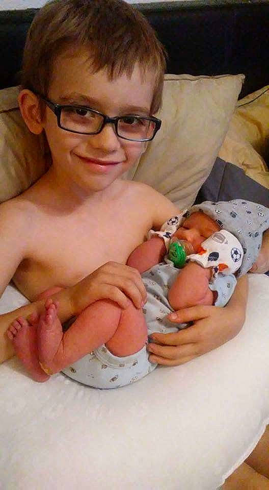 Brayden is registered to the contest to win money with this photo: arm, cheek, child, finger, glasses, hand, infant, joy, leg, muscle, person, product, skin, toddler, vision_care