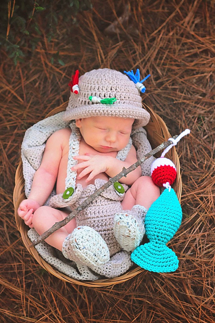 Cayson is registered to the contest to win money with this photo: baby, baby_toddler_clothing, basket, cap, child, crochet, fashion_accessory, grass, headgear, headwear, knit_cap, leaf, pattern, people_in_nature, person, shoe, sneakers, toddler, toy, wood