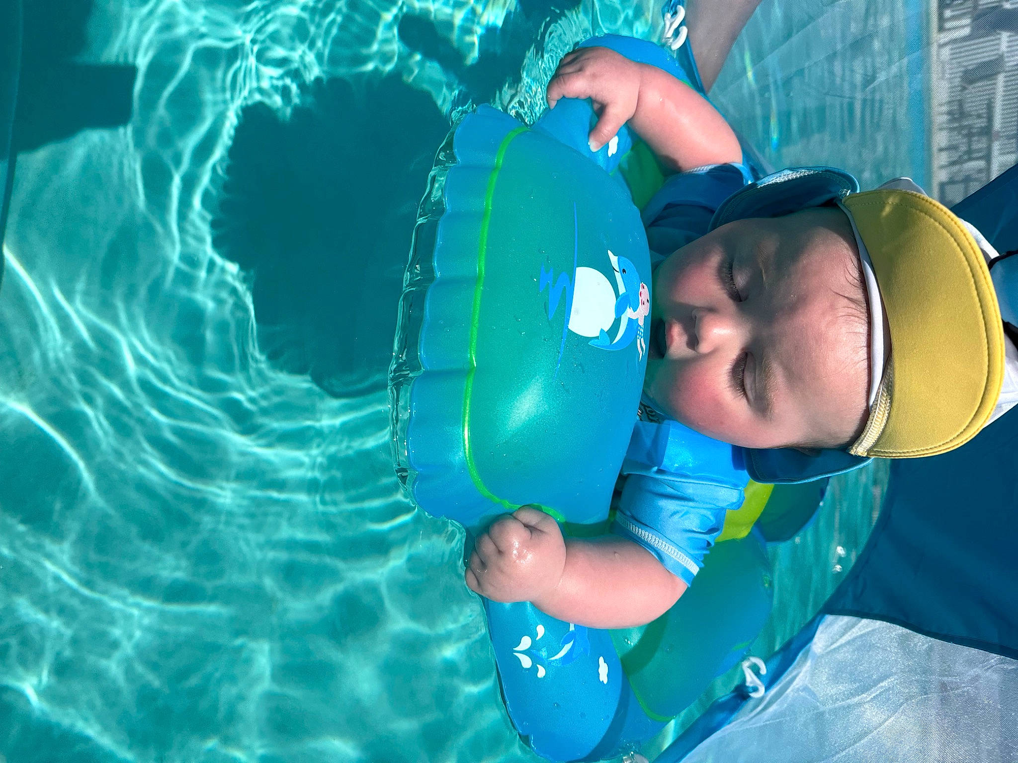 Cameron joined the competition — help win amazing prizes! aqua, baseball_cap, blue, cap, child, electric_blue, fun, games, happy, hat, headwear, inflatable, leisure, lifejacket, nature, person, personal_protective_equipment, play, recreation, toddler