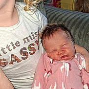 Layla Renee is registered to the contest to win money with this photo: baby, newborn, child, sibling, sleeping_baby, pajamas, pink_onesie, curly_hair, earring, couch, blanket, toy_house, indoor, portrait, cozy, hand, face, skin, family_moment, living_room