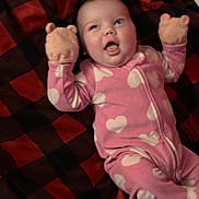 Lemailey is registered to the contest to win money with this photo: baby, black, blanket, checkered, child, cozy, cute, face, fuzzy, happy, heart_pattern, infant, lying_down, mittens, pink_onesie, playful, red, smiling, soft, tongue_out