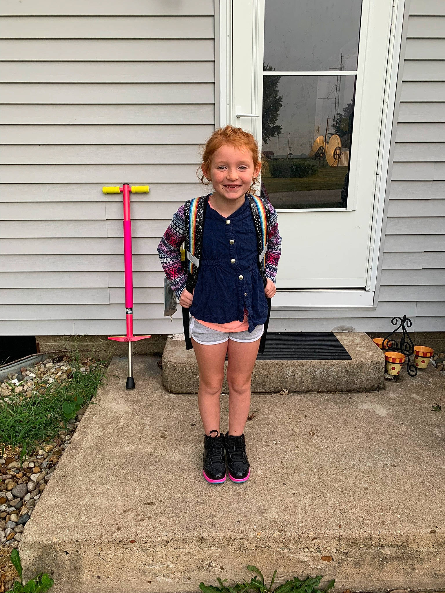 Nadia joined the competition — help win amazing prizes! asphalt, boot, child, denim, door, electric_blue, fun, grass, house, human_leg, joy, knee, magenta, pattern, person, plant, pumpkin, sleeve, smile, t_shirt