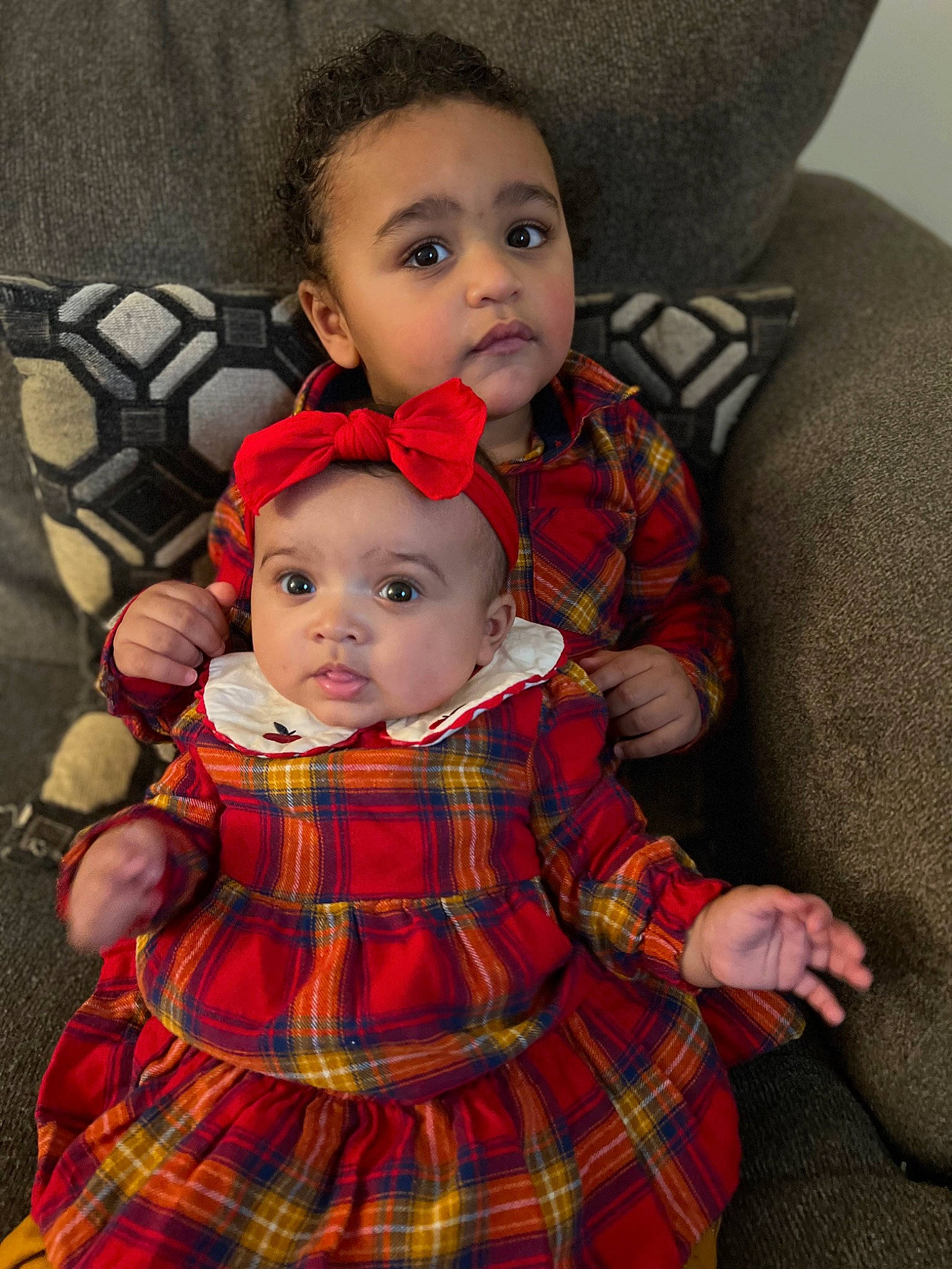 Kayden joined the competition — help win amazing prizes! baby, baby_toddler_clothing, cheek, child, comfort, dress, face, head, headwear, human_body, lap, organ, outerwear, pattern, people, person, plaid, skin, sleeve, tartan