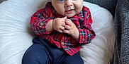 Remi joined the competition — help win amazing prizes! baby, child, plaid_shirt, navy_pants, socks, cap, cushion, smile, hands, face, blue_eyes, indoor, sofa, cozy, cute, portrait, clothing, seated, infant, hat