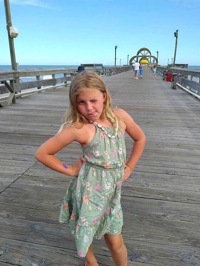 Addyson is registered to the contest to win money with this photo: beauty, boardwalk, day_dress, dress, fashion_design, fun, happy, horizon, human_leg, leisure, long_hair, one_piece_garment, pattern, person, sky, summer, tourism, travel, waist, walkway