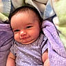 Violett is registered to the contest to win money with this photo: baby, infant, blanket, purple, clothing, smile, face, cute, child, soft, polka_dot, onesie, comfort, sleepwear, arm, skin, indoors, newborn, resting, expression