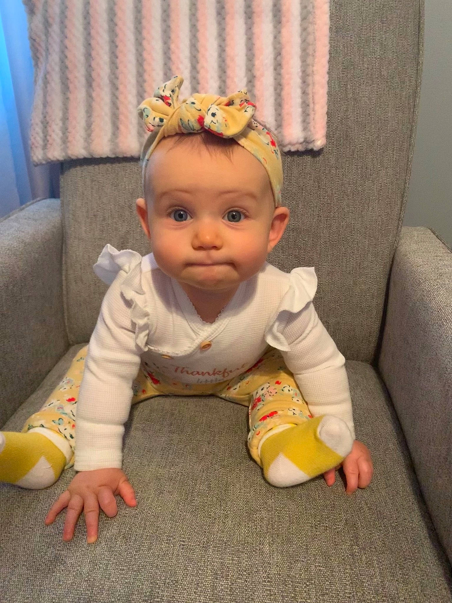 Haisley joined the competition — help win amazing prizes! baby, baby_toddler_clothing, cheek, child, chin, comfort, couch, curtain, eye, floor, flooring, hairstyle, happy, head, human_body, nose, person, sitting, sleeve, toddler